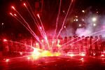 Demonstrators use firecrackers against police during a rally against the government's decision to suspend negotiations on joining the European Union for four years, outside the parliament's building in Tbilisi, Georgia, early Sunday, Dec. 1, 2024.