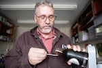 OSU professor Eric Jones taste tests maple syrup. 