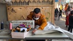 Bags that were used to transfer aid into Gaza are now being repurposed into tent walls.