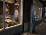 A broken window at a Pearl District business that was vandalized during a demonstration on Saturday, February 27, 2021.