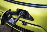 The charging cable is plugged into Kip Silverman's Hyundai Kona at his home in Portland, Ore., on Sept. 29, 2026.