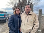 Rosa and Sergio Madrigal stand outside the farm they previously owned near Sunnyside, Wash.