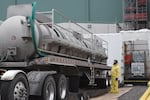 Workers offload chemicals into the Low-Activity Waste Facility at Hanford Vit Plant. Nitrogen, mixed with other materials, will simulate Hanford tank waste and be used to prepare the facility for operating with radioactive and chemical waste, possibly later this year.