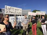 Neighbors of Daimler Trucks North America protest the company's new headquarter opening. Residents near the Swan Island truck maker have complained for years about persistent paint odors, but say little has changed.