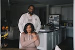 Edmund stands with his wife, Iris Garcia, inside their home where they live with their four daughters. Iris lost her job during the pandemic and their mortgage company offered them a forbearance.