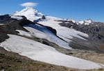 Nooksack Tribe glacier researchers cross a snowfield on their way to the Sholes Glacier on Mount Baker.