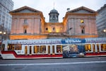 A TriMet MAX train glides past Pioneer Courthouse in downtown Portland.