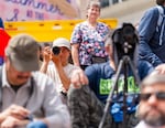 Charlie Zhang, the Oregon Chinese Coalition’s photographer for the event, takes photos of performers on stage.