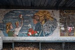 A Soviet-era mosaic celebrating coal miners at a bus stop in Dobropillya, Ukraine. Like the nearby coal mining center of Pokrovsk, Dobropillya frequently comes under aerial attack from Russian missiles and drones.