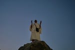 A Muslim pilgrim prays atop of the rocky hill known as the Mountain of Mercy, on the Plain of Arafat, during the annual Hajj pilgrimage near the holy city of Mecca, Saudi Arabia, Tuesday, May 26, 2026.