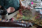 Student finishes a watercolor in art class at Newport Visual Art Center in Newport, Oregon.