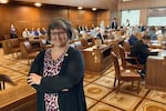 State Sen. Janeen Sollman, a Democrat from Hillsboro, poses on the Senate floor in the Oregon State Capitol in Salem.