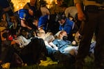 Police forces arrest pro-Palestinian demonstrators during a rally on Saturday, April 27, 2024 at Washington University. Protestors marched through campus and set up an encampment in response to the university's ties to Boeing, the supplier of many weapons to Israel used in the Gaza war.