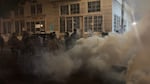 Federal officers spray and throw chemical gases at demonstrators a block up from the ICE processing facility south of downtown Portland on Saturday, Oct. 5, 2025.