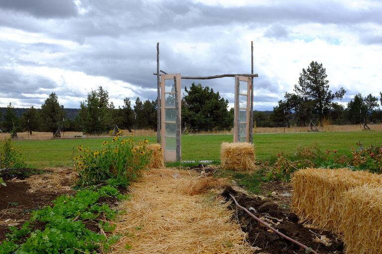 A rustic gate at Rainshadow Organics marks a transition from one field to the next.