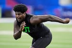 FILE - Oregon offensive lineman Josh Conerly Jr. runs a drill at the NFL football scouting combine in Indianapolis, Sunday, March 2, 2025.