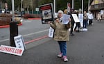 Volunteers with Free the Oregon Zoo Elephants protest Packy's memorial.