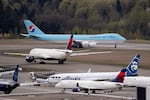 A Boeing 747-8F Korean Air Cargo jet taxis past other waiting aircraft to take-off at Seattle-Tacoma International Airport in this April 15, 2020 file photo.