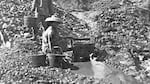 Chinese gold miners working a small stream