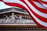 FILE - An American flag flies outside the Department of Justice in Washington, March 22, 2019.