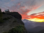 Volunteers gather at the High Rock Lookout at dawn to begin a day of repairs following devastating vandalism in June 2026.