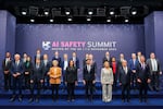 FILE - First row, from left, France's Minister for Economy, Finance, Industry and Digital Security Bruno Le Maire; German Economy and Climate Minister Robert Habeck, European Commission President Ursula von der Leyen, U.S. Vice President Kamala Harris, British Prime Minister Rishi Sunak, Italian Prime Minister Giorgia Meloni, U.N. Secretary General Antonio Guterres and Australian Deputy Prime Minister and Minister of Defense Richard Marles, middle and back row, from left, Google's James Manyika, President of the Carnegie Endowment for International Peace Tino Cuellar, AI Now Institute's Amba Kak, Mistral AI CEO Arthur Mensch, CEO of Amazon Web Services Adam Selipsky, Meta's Nick Clegg, Quebec AI Institute's Yoshua Bengio, Anthropic's Dario Amodei, OpenAI's Sam Altman, Microsoft's Brad Smith, Inflection AI Co-Founder Mustafa Suleyman, former acting director of the White House Office of Science and Technology Policy Alondra Nelson, Google DeepMind's Demis Hassabis, Schmidt Futures Founder Eric Schmidt, Chair of UK Frontier AI Taskforce Ian Hogarth and Inflection AI's Reid Hoffman pose for a group photo on the second day of the UK Artificial Intelligence Safety Summit at Bletchley Park, in Bletchley, England, on Nov. 2, 2023.