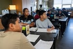 FILE - Students listen to sixth grade math teacher Debra Borman on the first day of school at Parkrose Middle School in Portland, Ore., in August.