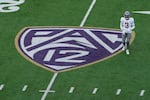 Washington State defensive back Cam Lampkin (3) walks near a Pac-12 logo during the first half of an NCAA college football game against Washington, Saturday, Nov. 25, 2023, in Seattle.