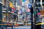 Law enforcement officers from multiple agencies work the scene on Bourbon Street after at least ten people were killed when a person allegedly drove into the crowd in the early morning hours of New Year's Day.