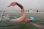 Endurance swimmer Lewis Pugh swims near the Edgartown Harbor Light on Thursday in Edgartown, Mass.