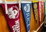FILE - The Oregon Promise Grant's impact on high school graduate enrollment rates has been muted. Pennants from colleges and universities across the country adorn the office of a Benson High School counselor's office on February 2, 2024.