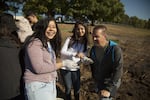 David Ellingsen (right) looks at bones his students brought to him.