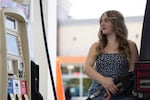 Alicia Tryon pumps her own gas Friday, Aug. 4, 2023, in Eugene, Ore. Oregon drivers have for months been able to pump their own gas for the first time since the 1950s, but a labor union is spearheading an effort to return to full-service fueling only.