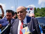 Rudy Giuliani speaks outside the Fulton County jail in Atlanta on Aug. 23, before he surrendered on 13 felony charges related to efforts to try to overturn the 2020 election.
