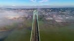 The St. Johns bridge was designed by David Steinman and completed in 1931. Today, the bridge is painted ODOT Green, but it was initially supposed to be black with yellow stripes.