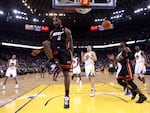 LeBron James reacts after dunking the ball as his Miami Heat played the Golden State Warriors on Jan. 10, 2012, in Oakland, California.