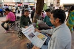 People read U.S. President-elect Donald Trump election news early morning sitting at a roadside tea shop in Lucknow, India on November 7.