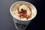 A pumpkin spice latte drink rests on a table at a Starbucks in New York on Aug. 24, 2023.