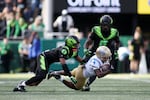 UCLA wide receiver Semaj Morgan (4) dives with the ball during the first half of an NCAA college football game against Oregon, Saturday, Oct. 10, 2026, in Eugene, Ore.