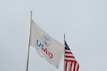 A USAID and American flag outside of United States Agency for International Development (USAID) headquarters in Washington, DC, on Feb. 3, 2025.