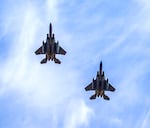 Two F-15 Eagle fighter jets from the Oregon Air National Guard's 142nd Wing conduct a flyover during the 2024 Oregon Remembers Memorial Day Tribute at the Oregon World War II Memorial in Salem, Ore., on Monday, May 27, 2024. The flyover was part of the annual ceremony paying tribute to fallen U.S. service members, and one of 26 flyovers completed across the state.
