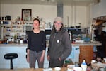 Rachel Christenson and Peter Wale live in the old Manitou Cafe with no electricity. They burn a wood stove for heat and charge a car battery with a small solar panel to power one light bulb and a laptop.