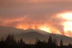The smoke of the Taylor Creek Fire still plumes behind the Joint Information Center, just outside of Grants Pass, OR.