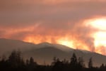 The smoke of the Taylor Creek Fire still plumes behind the Joint Information Center, just outside of Grants Pass, OR.