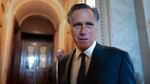 Sen. Mitt Romney, R-Utah, and other senators arrive at the chamber for votes at the U.S. Capitol on September 6.