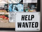 A "Help Wanted" sign is posted at a restaurant in Los Angeles on Feb. 2, 2023. U.S. employers added 311,000 jobs last month, a number that indicates the labor market remains fairly hot.