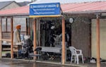 Rain pours outside the Sikh Center of Oregon. The members of the gurdwara renovated this garage into a kitchen and eating space.