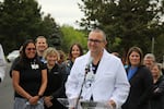 Dr. Joshua Plank speaks outside St. Charles Medical Center in Bend, where a group of providers announced June 3, 2022 they intended to form a union.