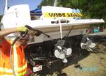 Cleaning off a boat from another state, to make sure it doesn't carry any invasive species.