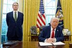 FILE - President Donald Trump speaks as Treasury Secretary Scott Bessent listens as Trump prepares to sign an executive order in the Oval Office of the White House, Feb. 3, 2025, in Washington.